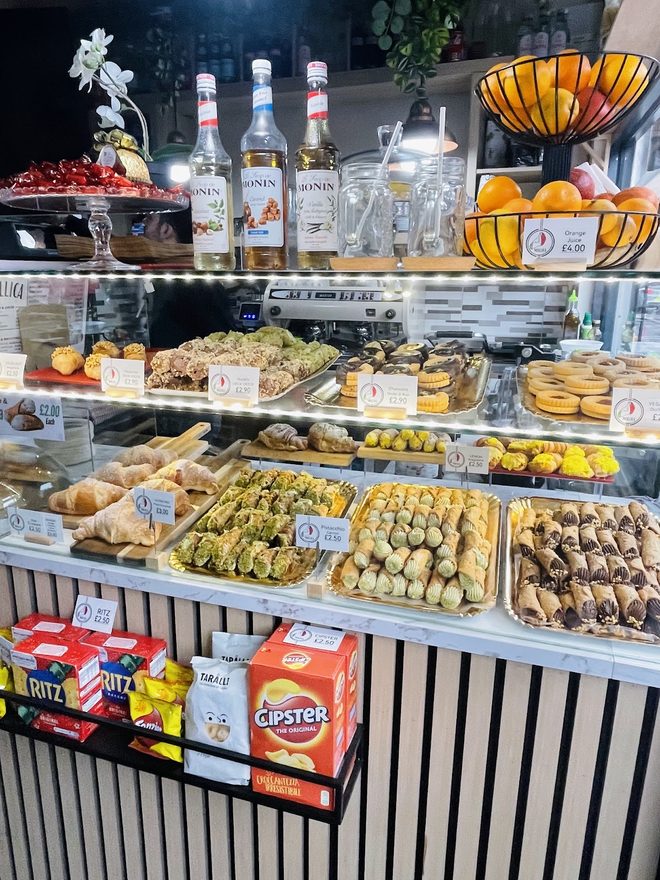 The glass pastry counter with cannoli and sfogliatelle